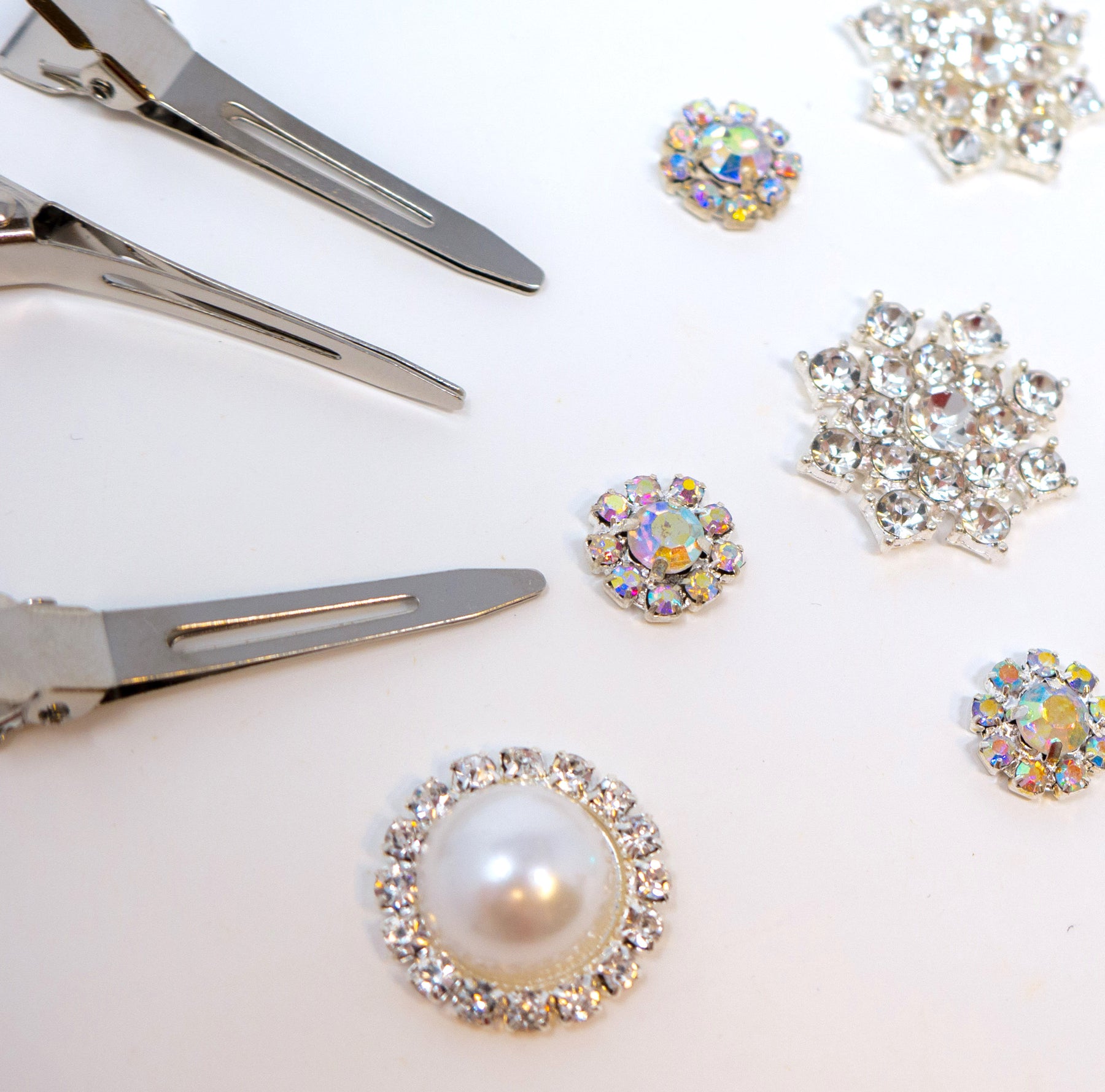 The highest quality of metal and plastic hardware available on the market for hair accessories. Our hardwards catalog includes clips, headbands, single prong clips, barrettes, snap clips and more. Perfect bling and rhinestone additions as well.
